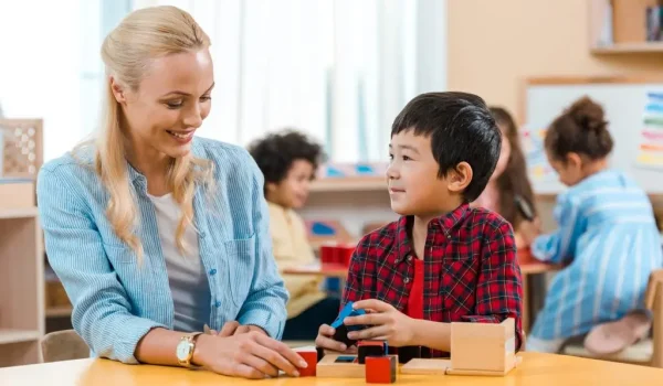 Free Montessori Course - Montessori teacher with student